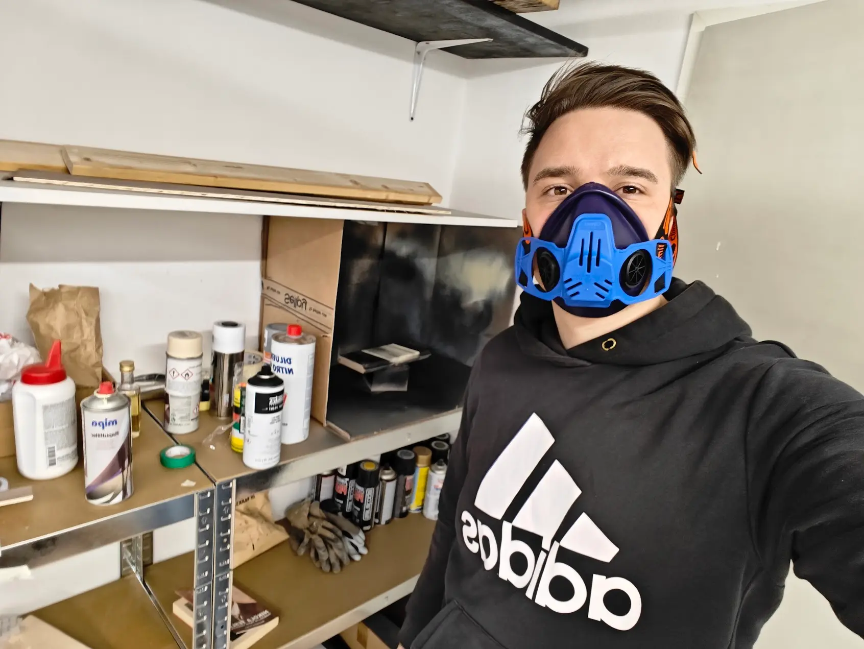 Lovro in the painting booth — hands-on work